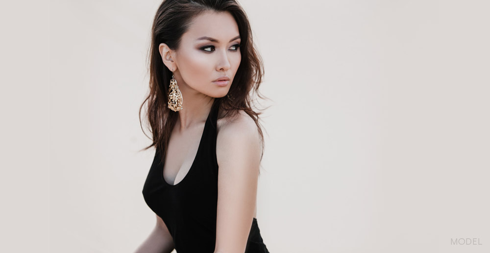 Side profile of Female Asian American Model Look Behind Her