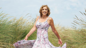 Beautiful female in a dress in a field