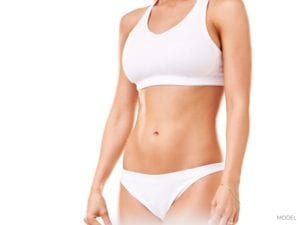 Closeup of Female Abdomen in White Bikini