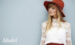 Blond Model in Red Hat Looking To The Side